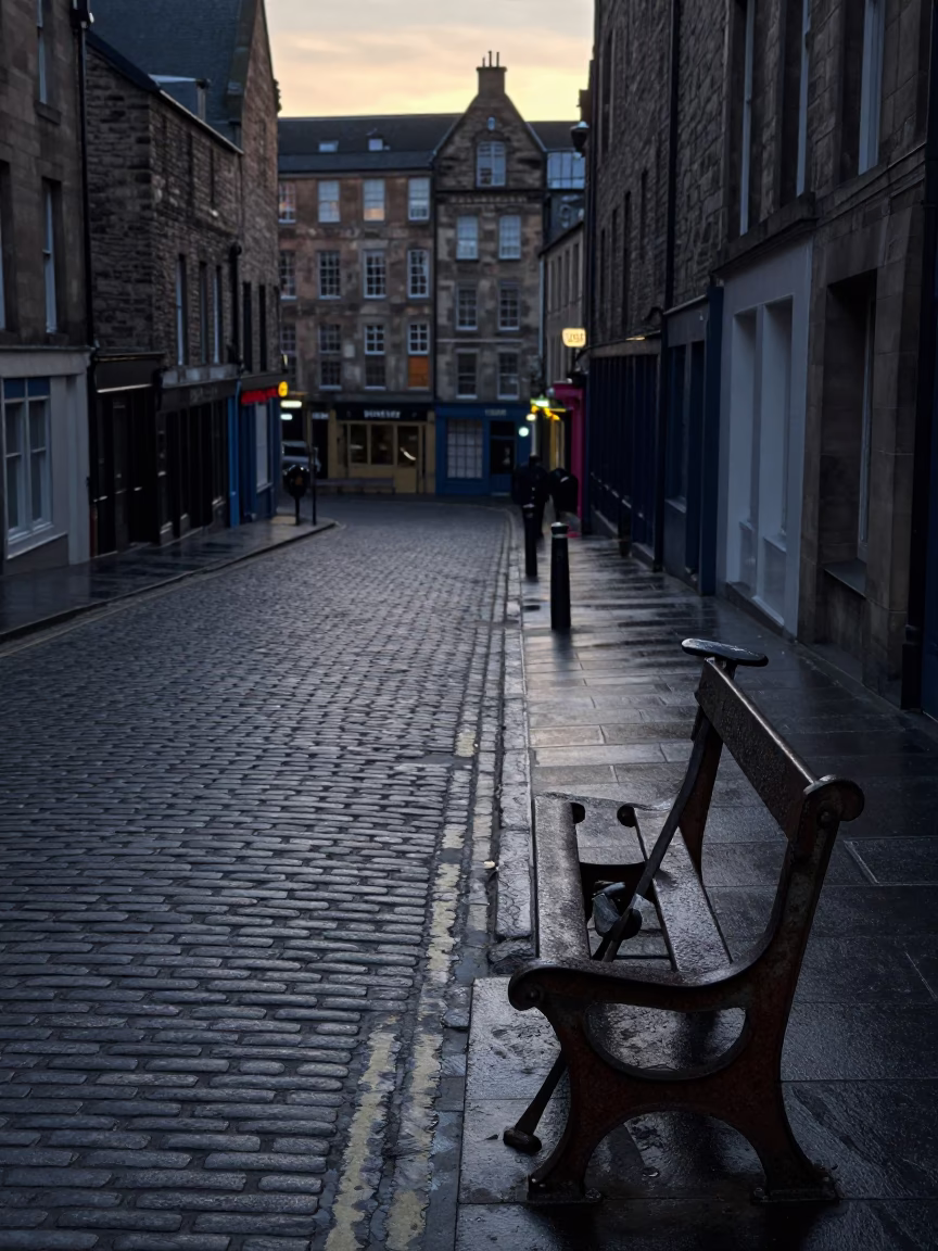 Pre-Dawn Edinburgh Street Scene with Crowbar and Rusty Bench Near Castle in in Edinburgh, United Kingdom