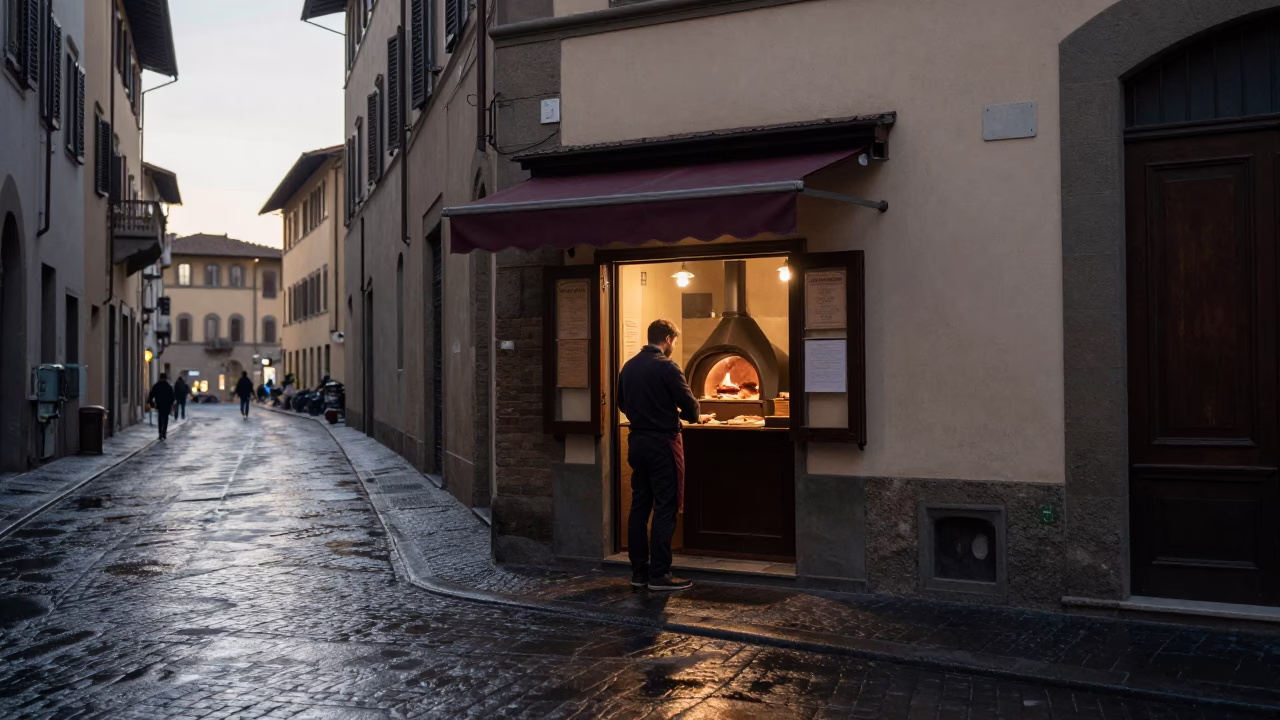 Pre-dawn Florence Street Scene with Local Bakery and Morning Commuters in in Florence, Italy