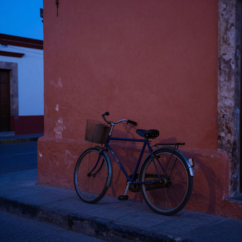 Pre-dawn Guadalajara street scene with vintage bicycle and blue and white porcelain plate in in Guadalajara, Mexico