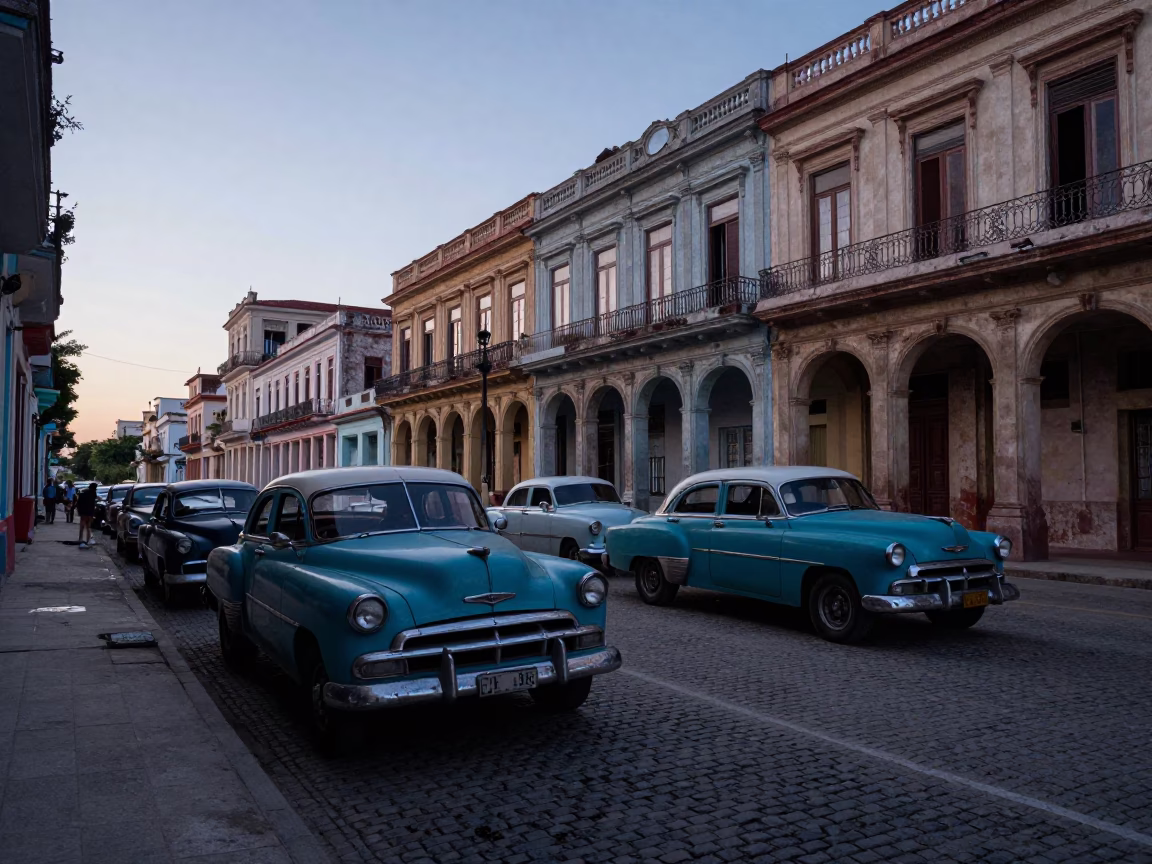 Pre-dawn Havana Cuba street scene with vintage cars and colonial architecture before sunrise in in Havana, Cuba