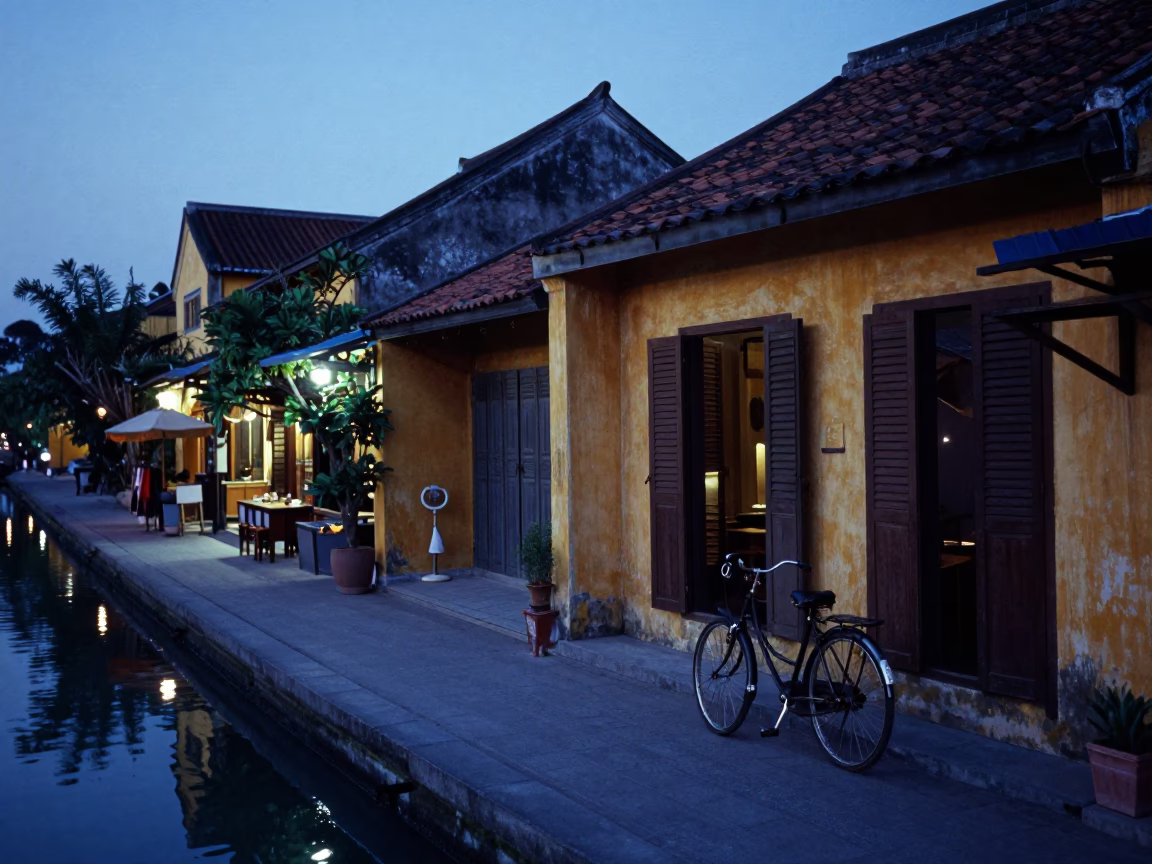 Pre-dawn Hoi An Vietnam street scene with bicycle and canal reflections in in Hoi An, Vietnam
