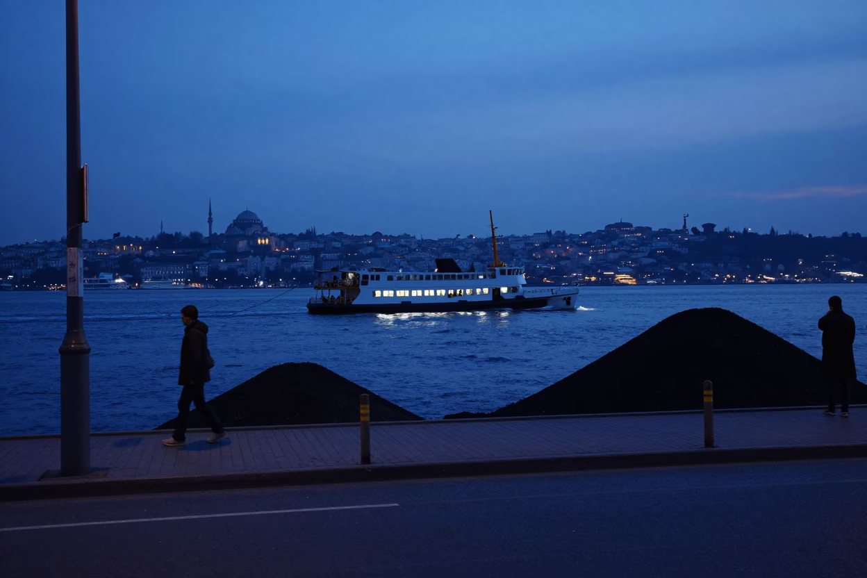 Pre-dawn Istanbul Street Scene with Chain Ferry and Coal Barge in in Istanbul, Turkey