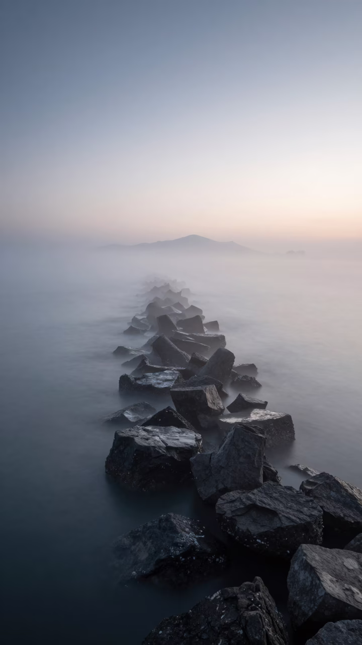 Pre-dawn Izmir Turkey Sea Fog Crawling Over Breakwater at Dawn in in Izmir, Turkey