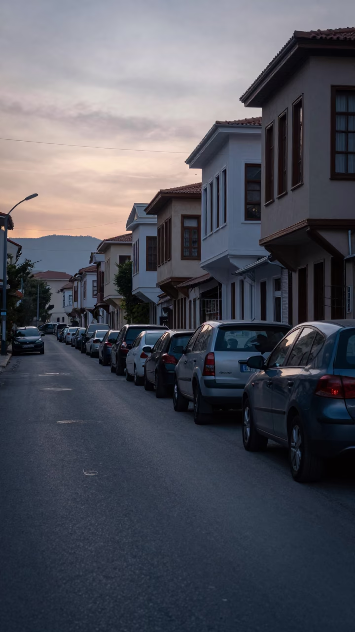 Pre-dawn Izmir Turkey street scene with parked vehicles and quiet urban architecture in in Izmir, Turkey