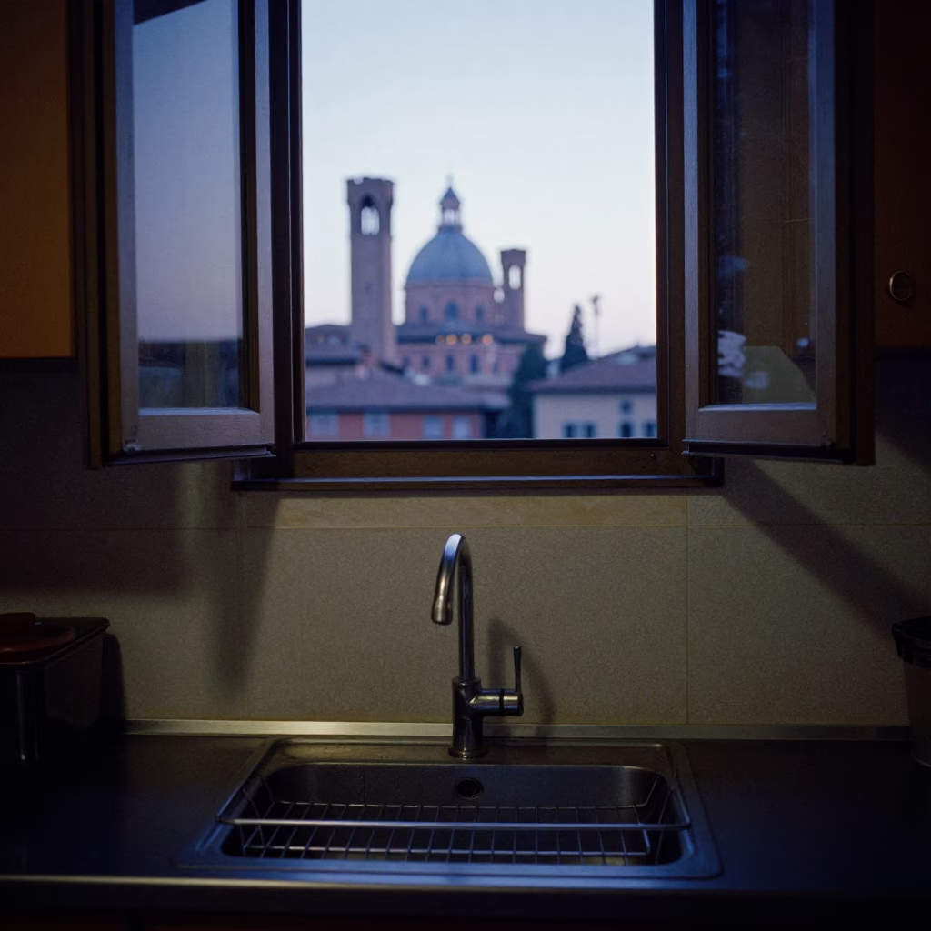 Pre-Dawn Kitchen Scene in Bologna Italy with Dish Rack and Sink Strainer in in Bologna, Italy