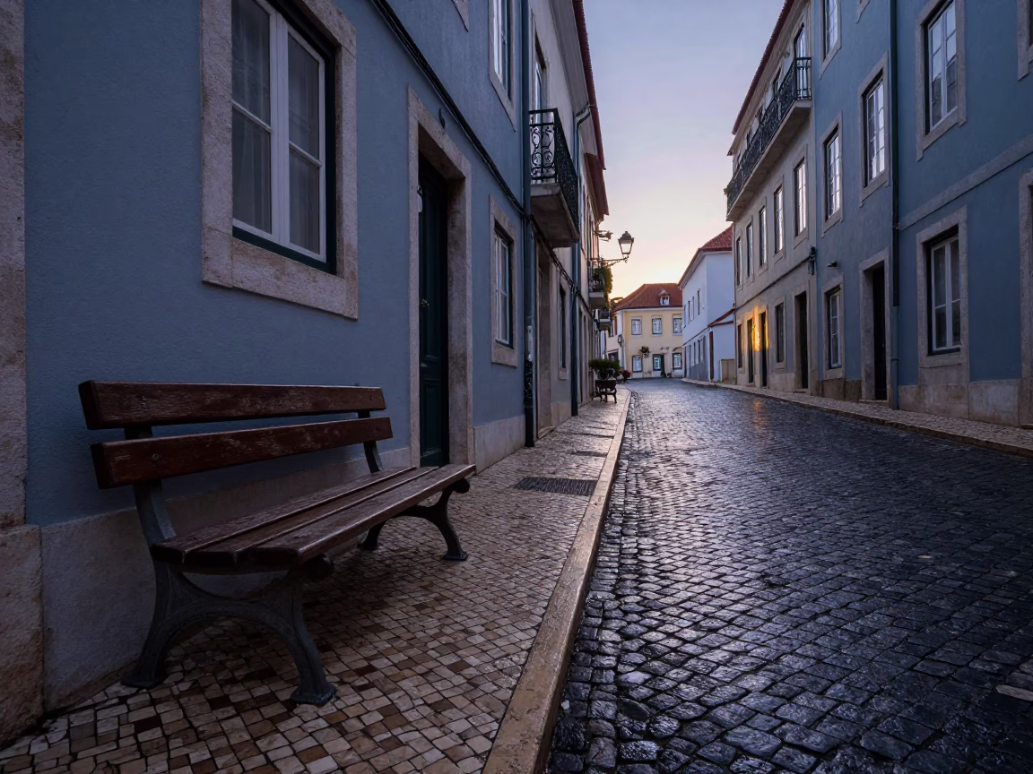 Pre-dawn Lisbon street scene with wet cobblestones and traditional azulejo tiles in in Lisbon, Portugal