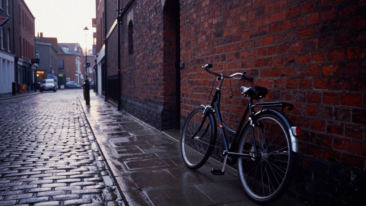 Pre-dawn Liverpool street scene with vintage bicycle and wet pavement reflections in in Liverpool, United Kingdom
