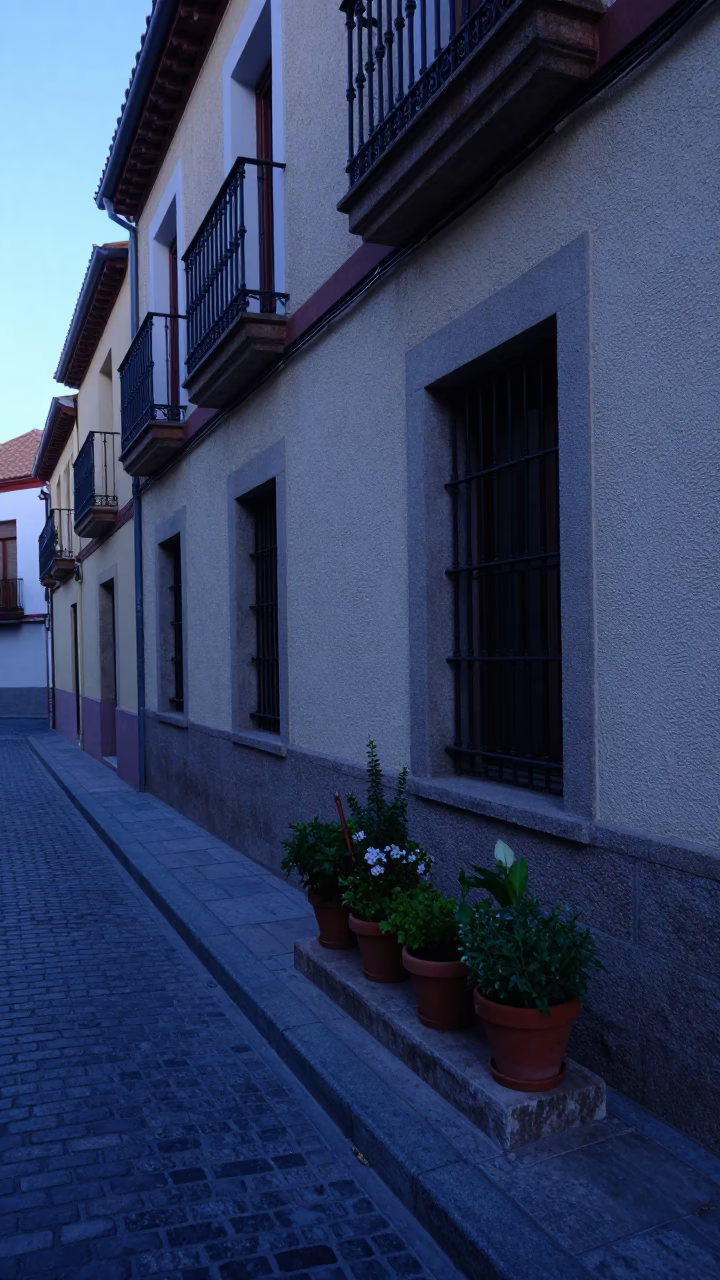Pre-dawn Madrid Street Scene with Potted Herbs and Pruning Shears in in Madrid, Spain