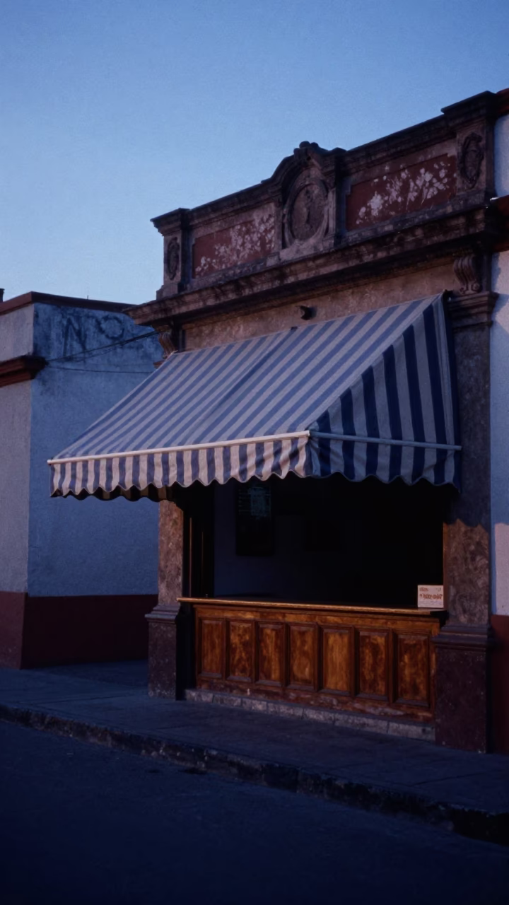 Pre-dawn Mexico City street scene with vintage awning and empty tray in in Mexico City, Mexico