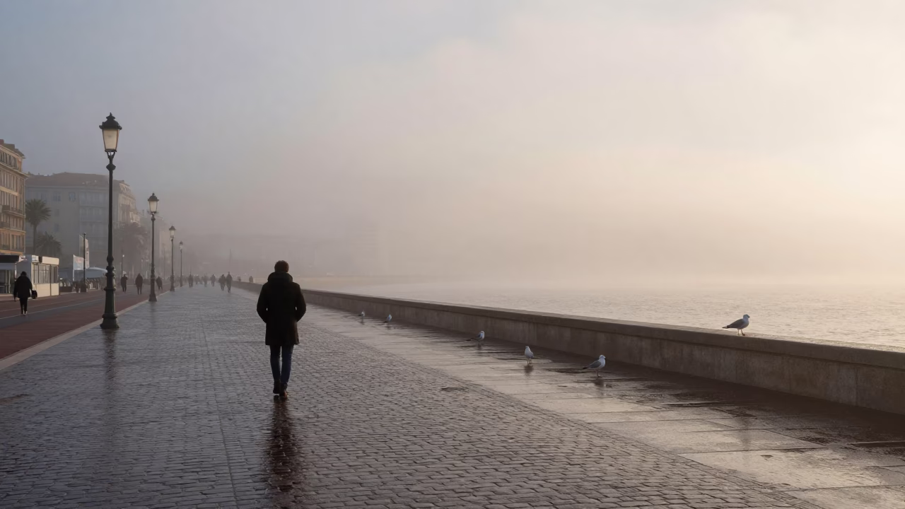 Pre-Dawn Mist on Nice Promenade with Seagulls and Wet Cobblestones in in Nice, France