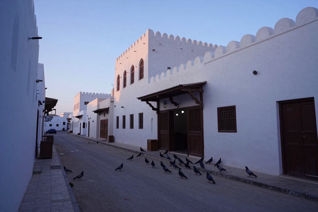 Pre-dawn Muscat Street Scene with Pigeons and Traditional Architecture in in Muscat, Oman