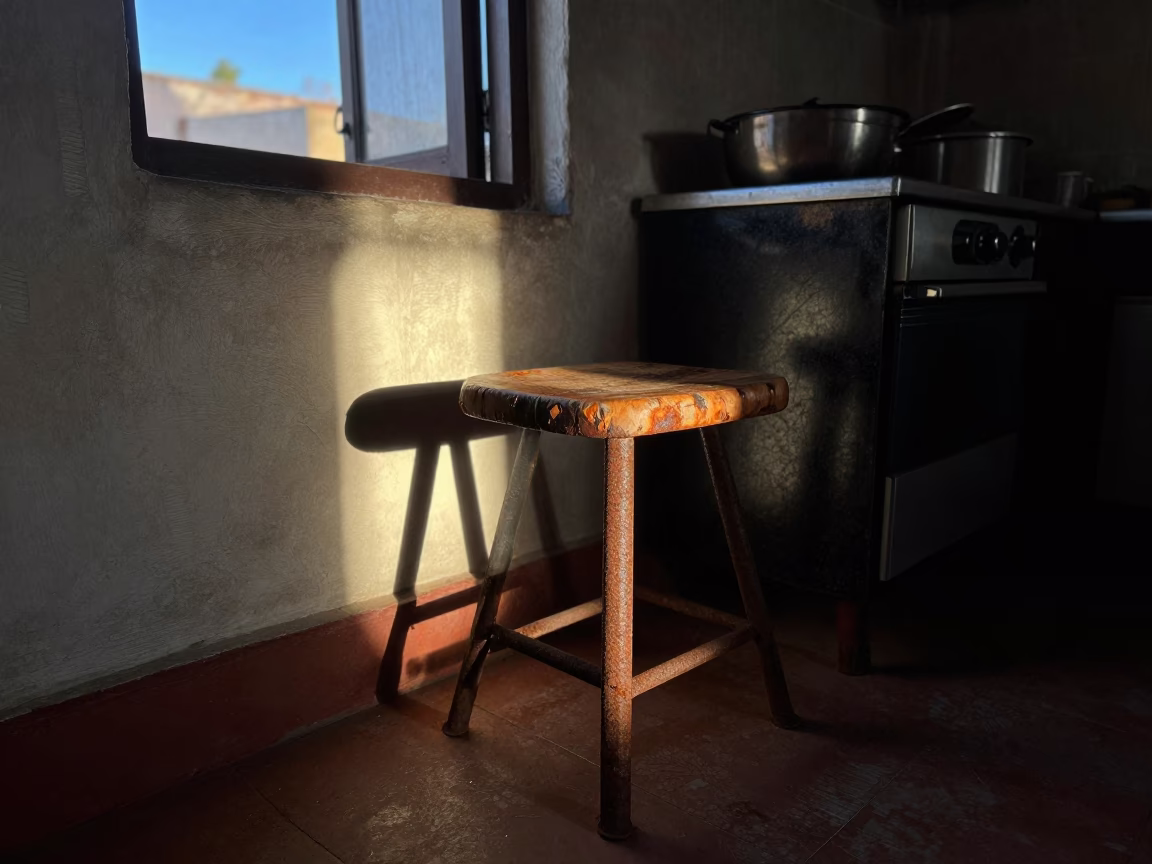 Pre-dawn Oaxaca Kitchen Scene with Rusty Stool and Grease-Sheened Basin in in Oaxaca, Mexico