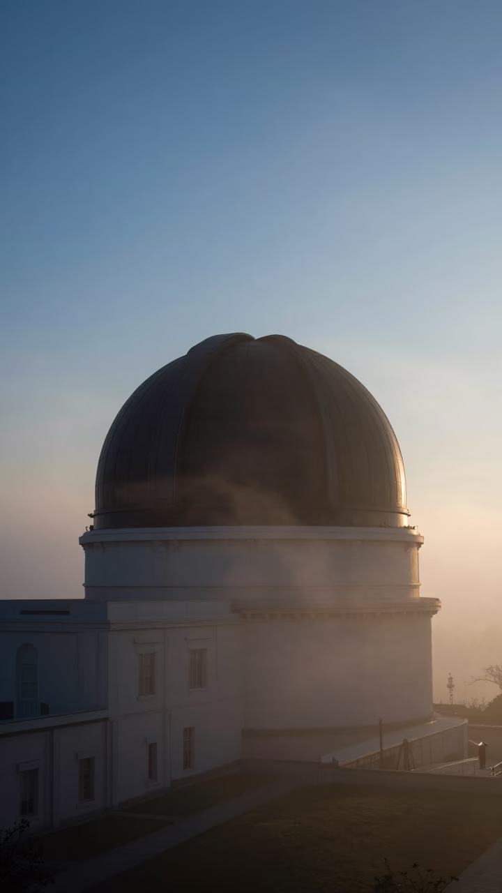 Pre-Dawn Observatory Dome Silhouette Above Budapest Fog Before Sunrise in in Budapest, Hungary
