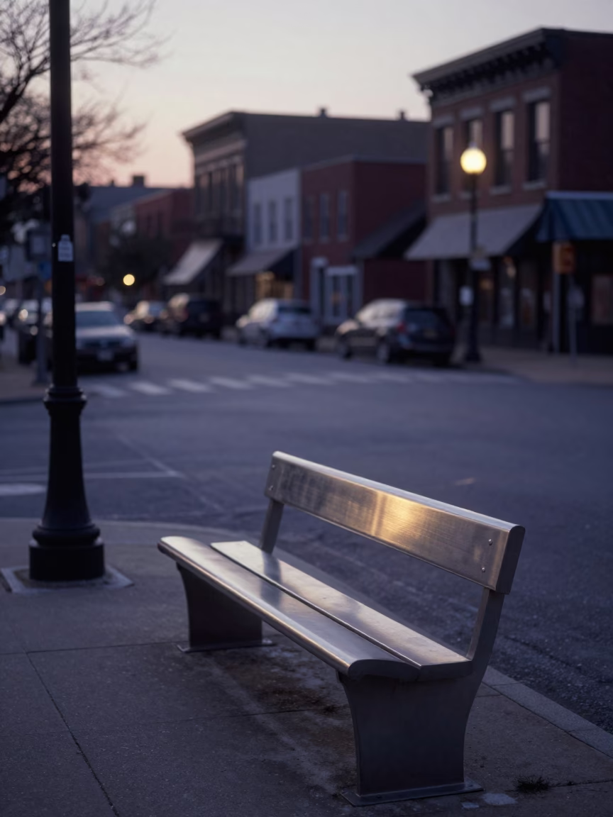 Pre-dawn Philadelphia Street Corner with Brushed Steel Bench and Early Morning City Lights in in Philadelphia, Pennsylvania, United States