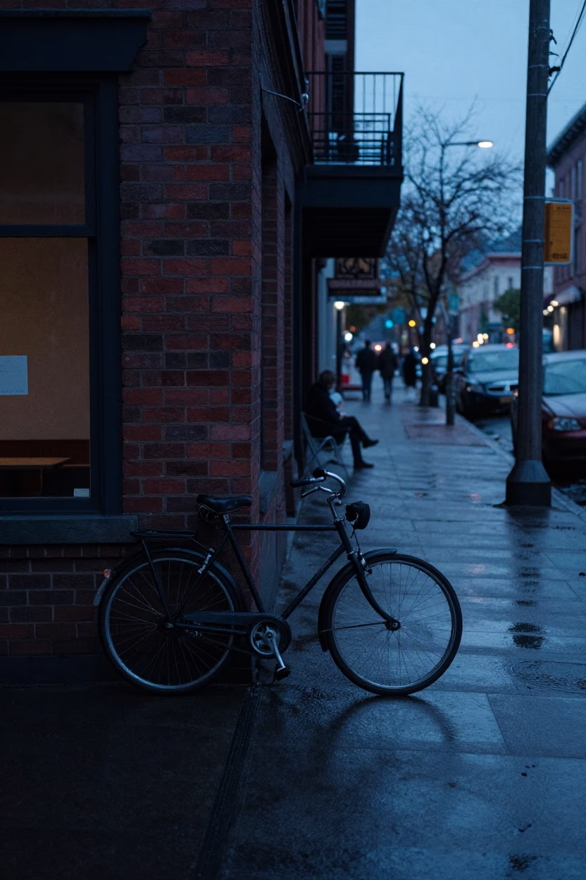 Pre-dawn Portland Street Scene with Bicycle and Wet Pavement Reflections in in Portland, Oregon, United States