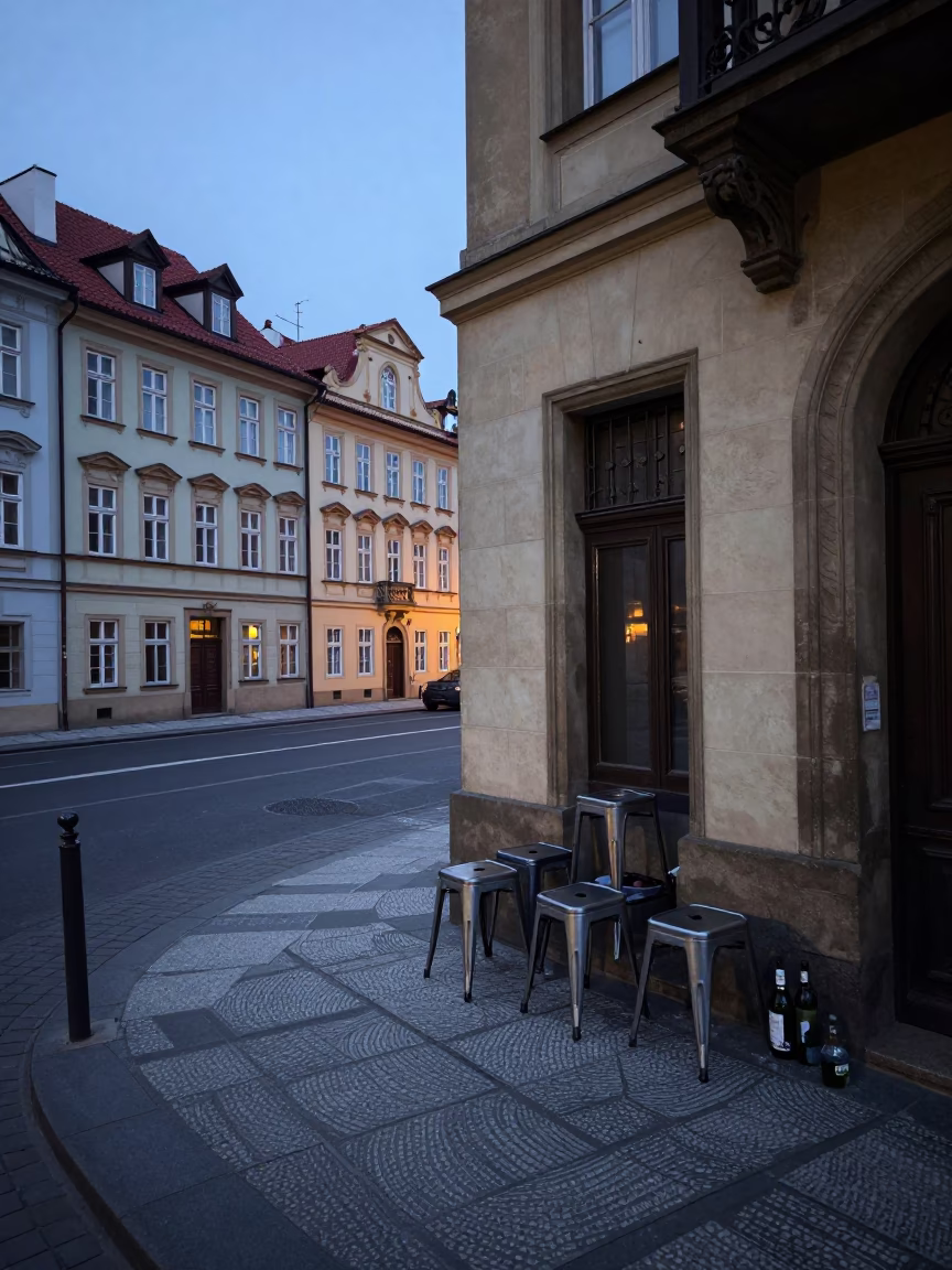 Pre-dawn Prague Street Scene with Metal Stools and Bottle Near Tunnel Portal in in Prague, Czech Republic