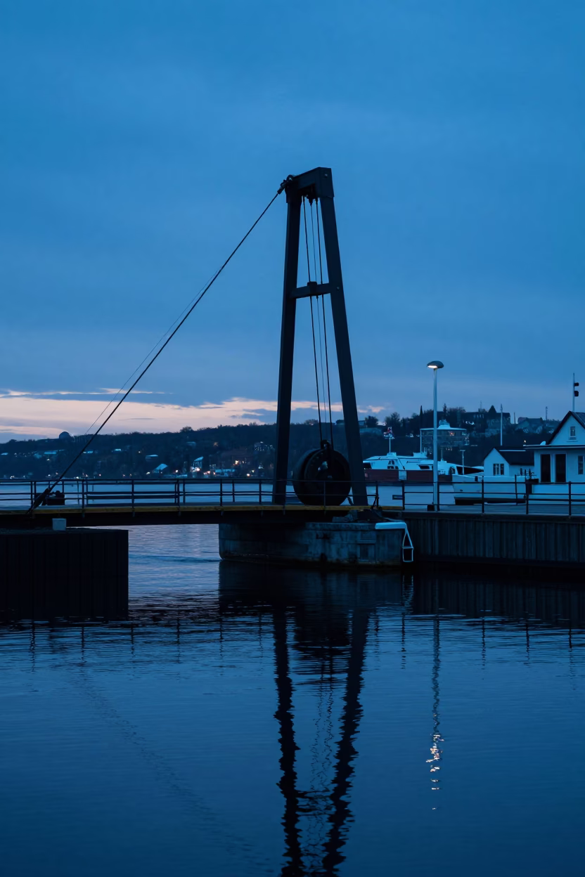 Pre-dawn Quebec City Harbor with Drawbridge Counterweight and Oil-Slick Reflections in in Quebec City, Quebec, Canada