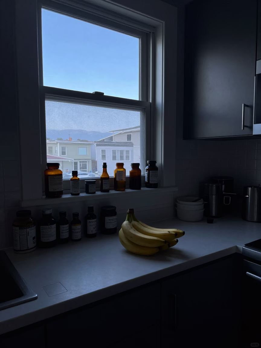 Pre-dawn San Francisco apartment kitchen counter with bananas and apothecary jar in in San Francisco, California, United States