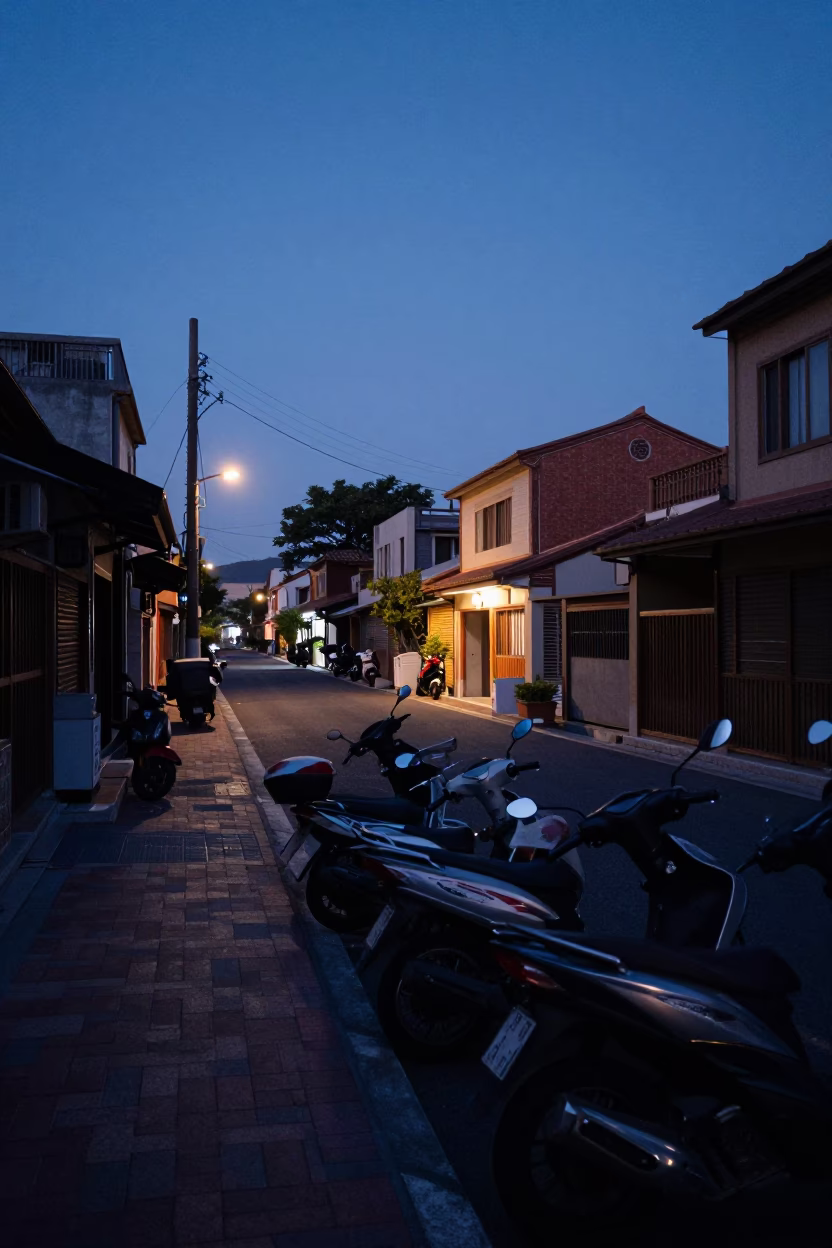 Pre-dawn street life in Tainan Taiwan with parked scooters and quiet alleyway in in Tainan, Taiwan