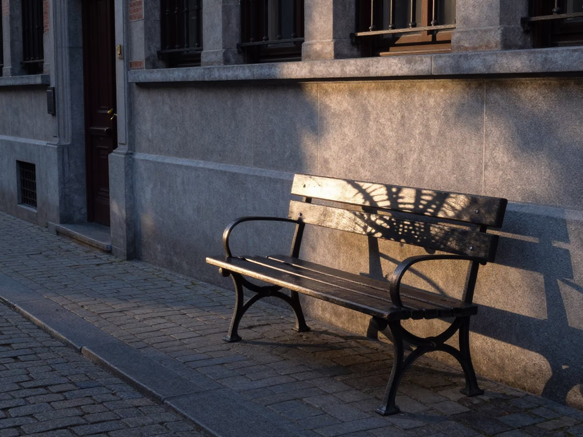 Pre-dawn street scene in Brussels Belgium with wicker shadow on bench slat in in Brussels, Belgium