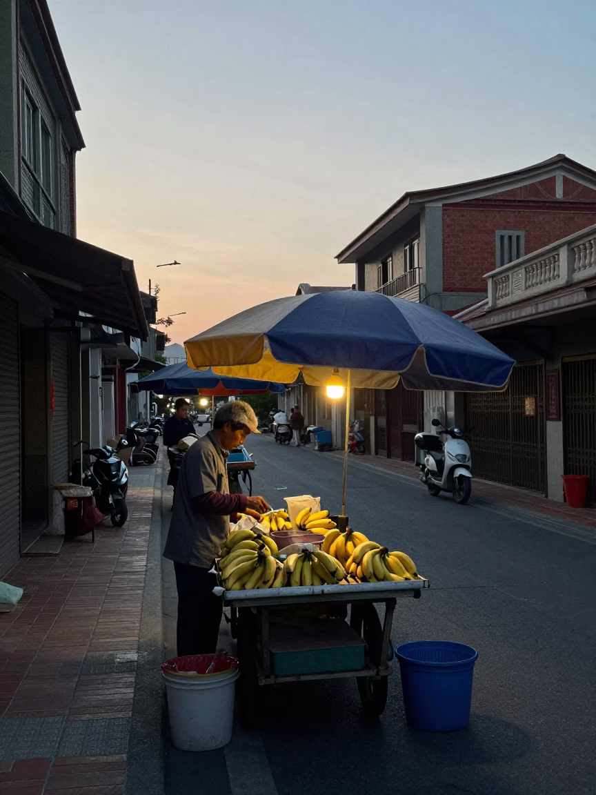 Pre-dawn street scene in Tainan Taiwan with vendors and umbrellas in in Tainan, Taiwan