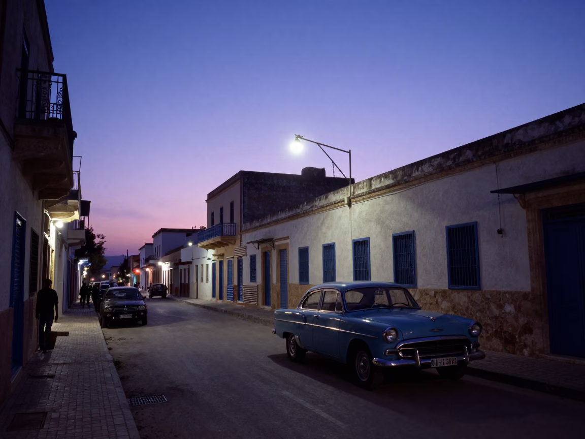 Pre-dawn street scene in Tunis Tunisia with vintage car and local market activity in in Tunis, Tunisia