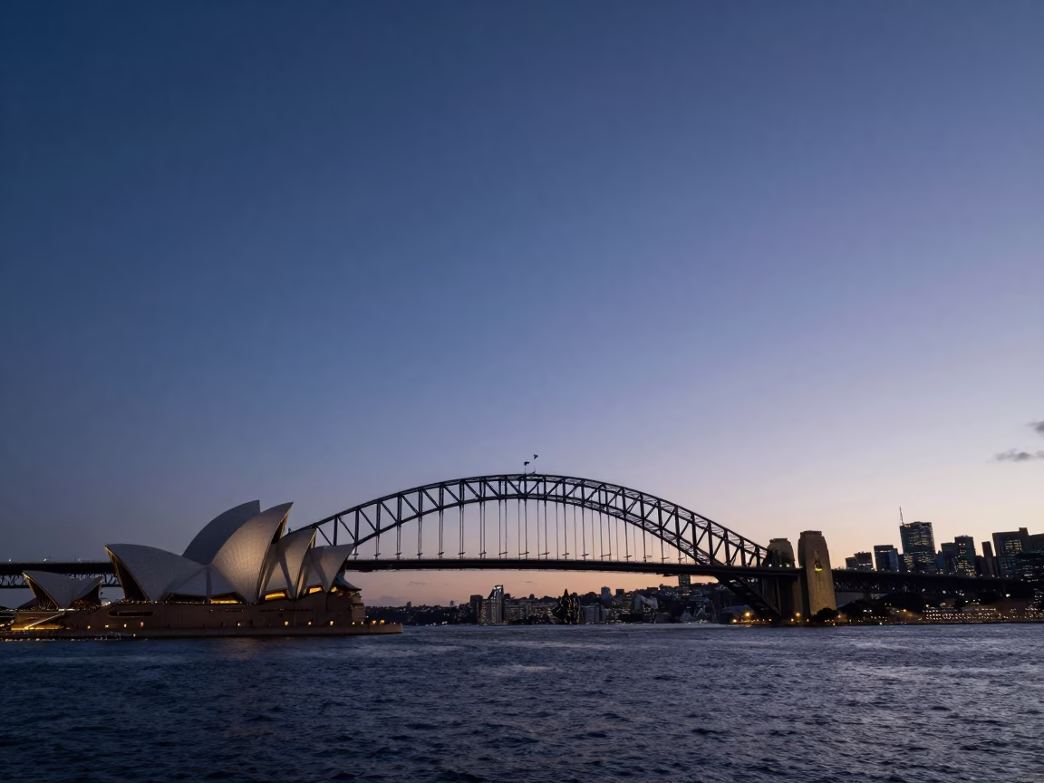 Pre-dawn Sydney Harbour Bridge and Opera House skyline in still early morning hours in in Sydney, New South Wales, Australia