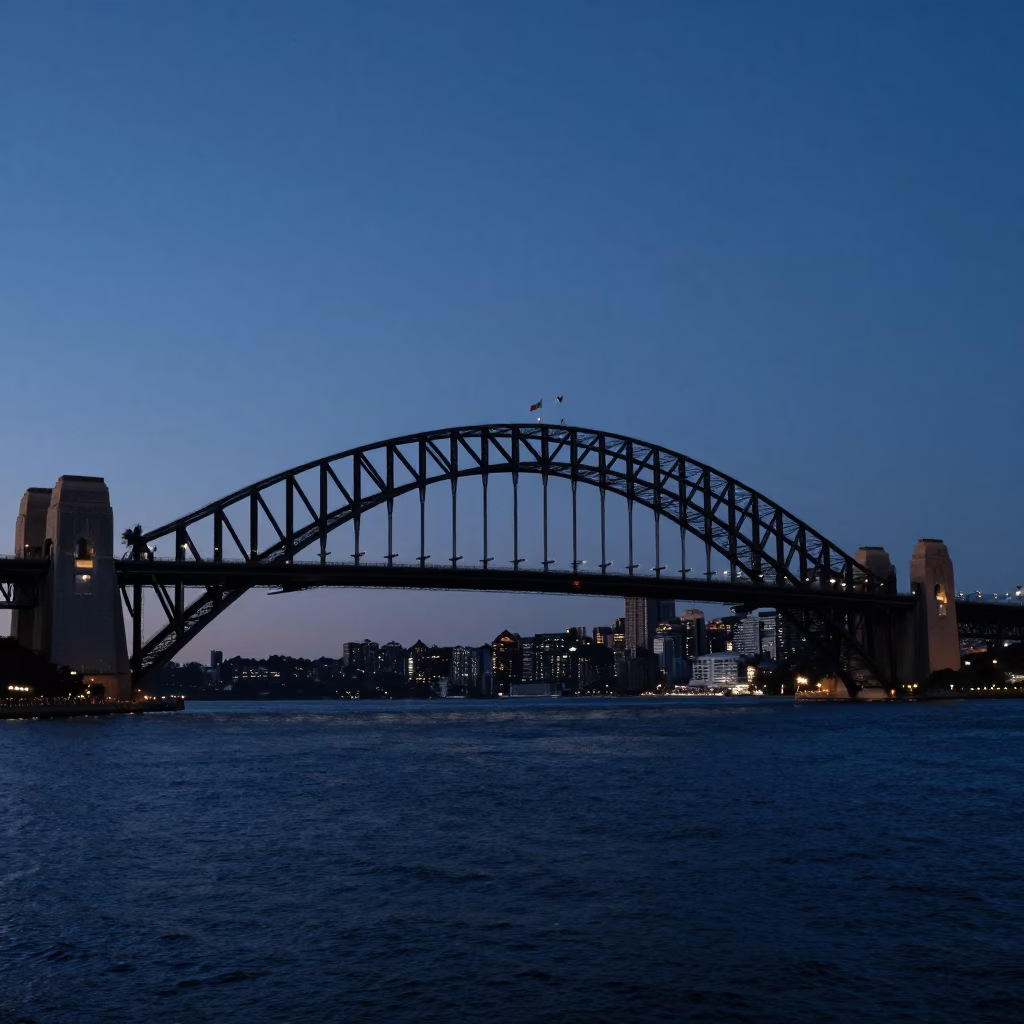 Pre-dawn Sydney Harbour Bridge steel arches and quiet waterfront streets in in Sydney, New South Wales, Australia