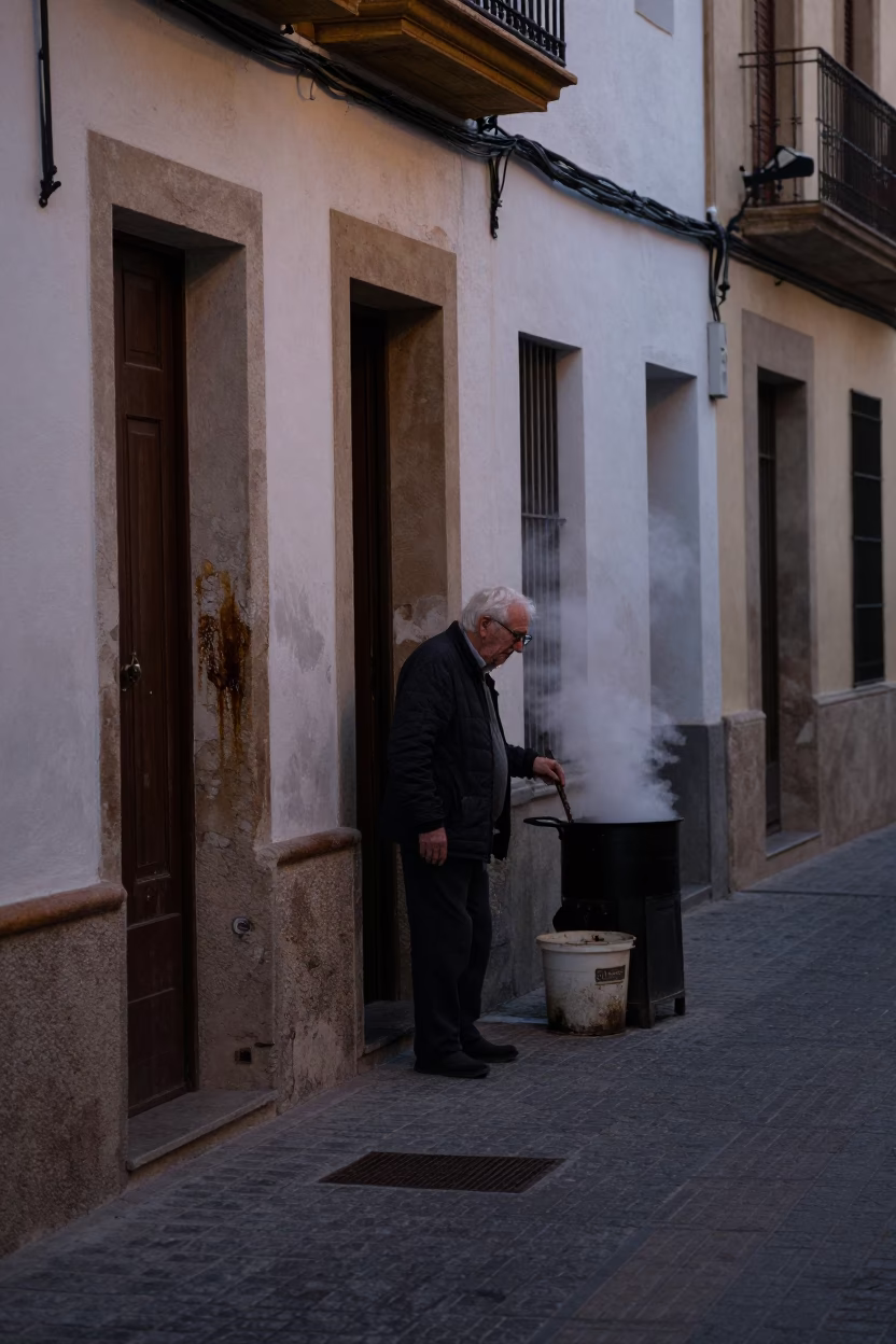 Pre-dawn Valencia street scene with smudged walls and cooking pot in in Valencia, Spain