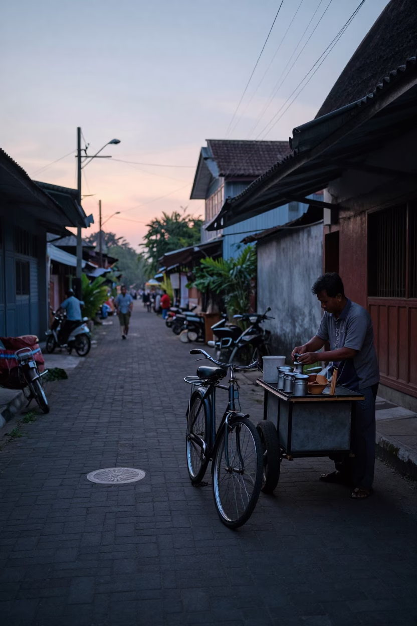 Pre-Dawn Yogyakarta Street Scene with Vintage Bicycle and Local Morning Routine in in Yogyakarta, Indonesia
