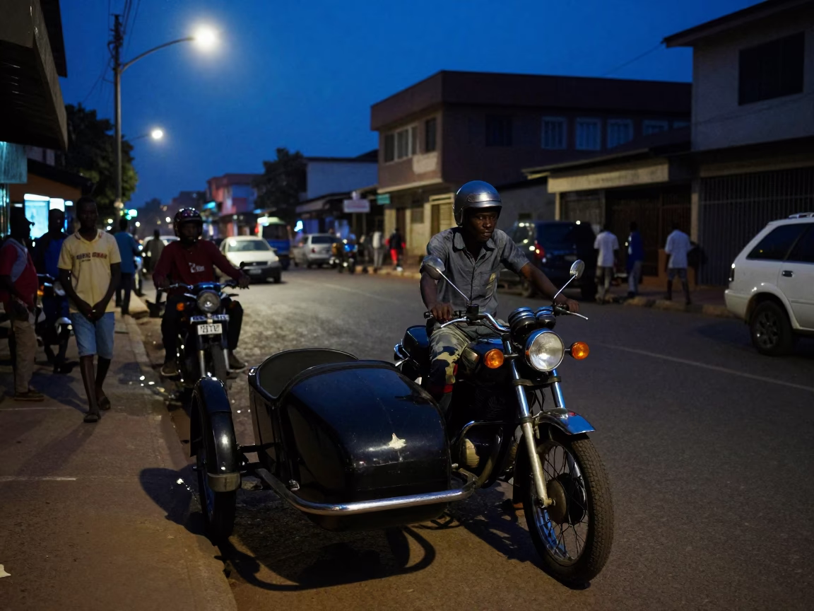 Predawn Accra Street Scene with Vintage Motorcycle and Cement Mixer in Ghana in in Accra, Ghana
