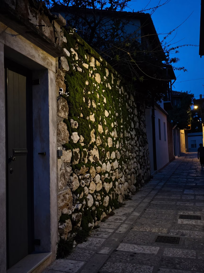 Predawn Athens Street Scene with Mossy Stone Wall and Ladder-Back Chair in Greece in in Athens, Greece