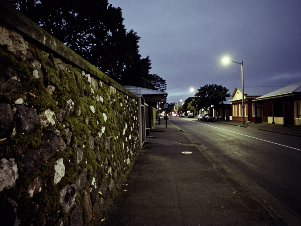 Predawn Auckland Street Scene with Mossy Stone Wall and Vintage 1970s Car in in Auckland, New Zealand