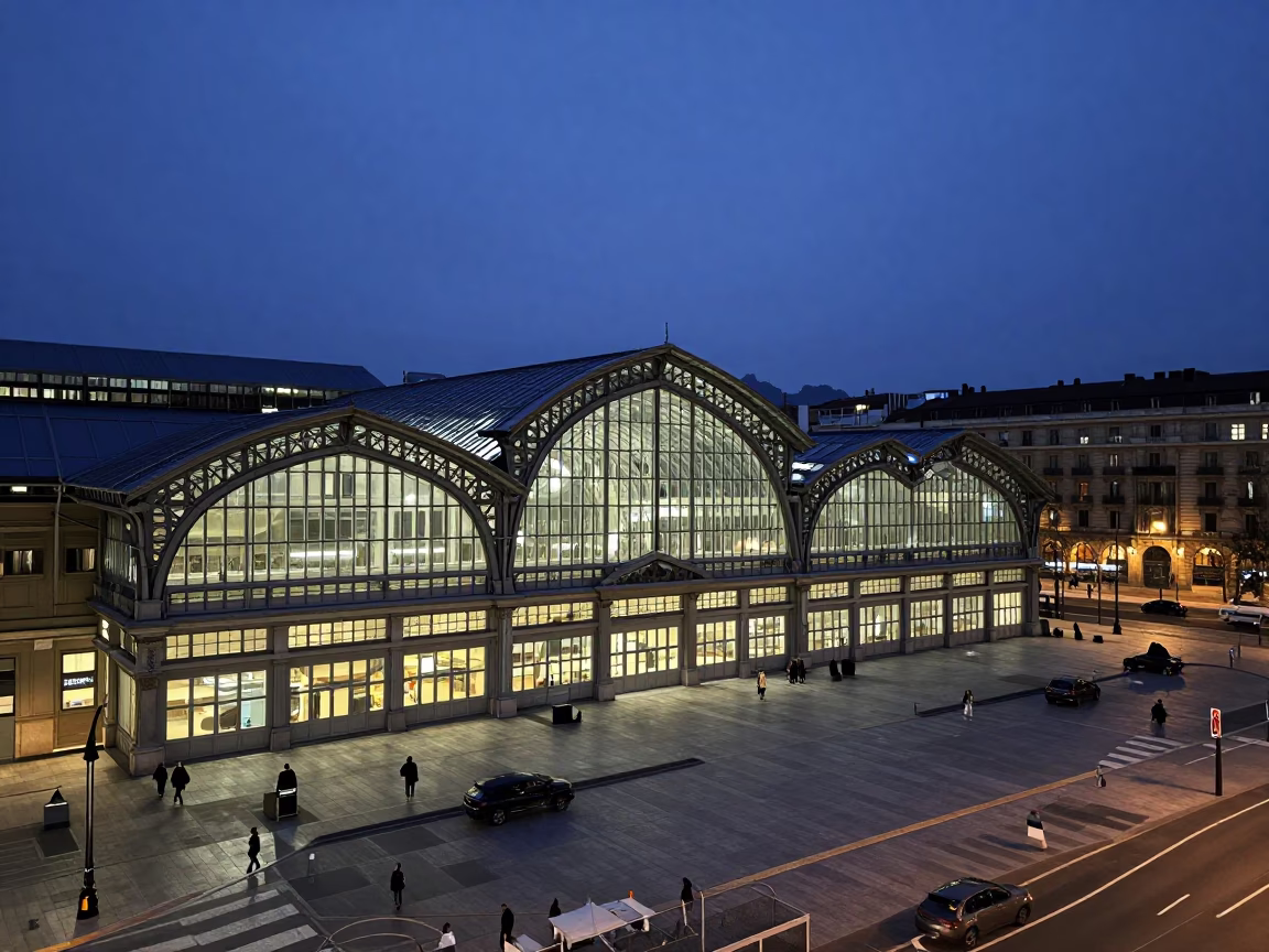 Predawn Bilbao Spain Glass Steel Train Station Arched Roof City Lights in in Bilbao, Spain