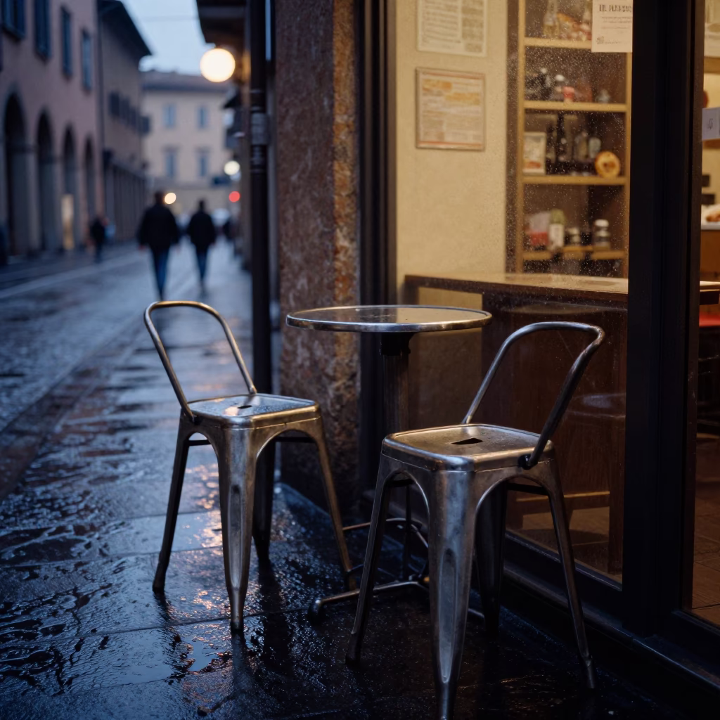 Predawn Bologna Italy Street Scene with Metal Stools and Wet Perforated Metal Overpass in in Bologna, Italy