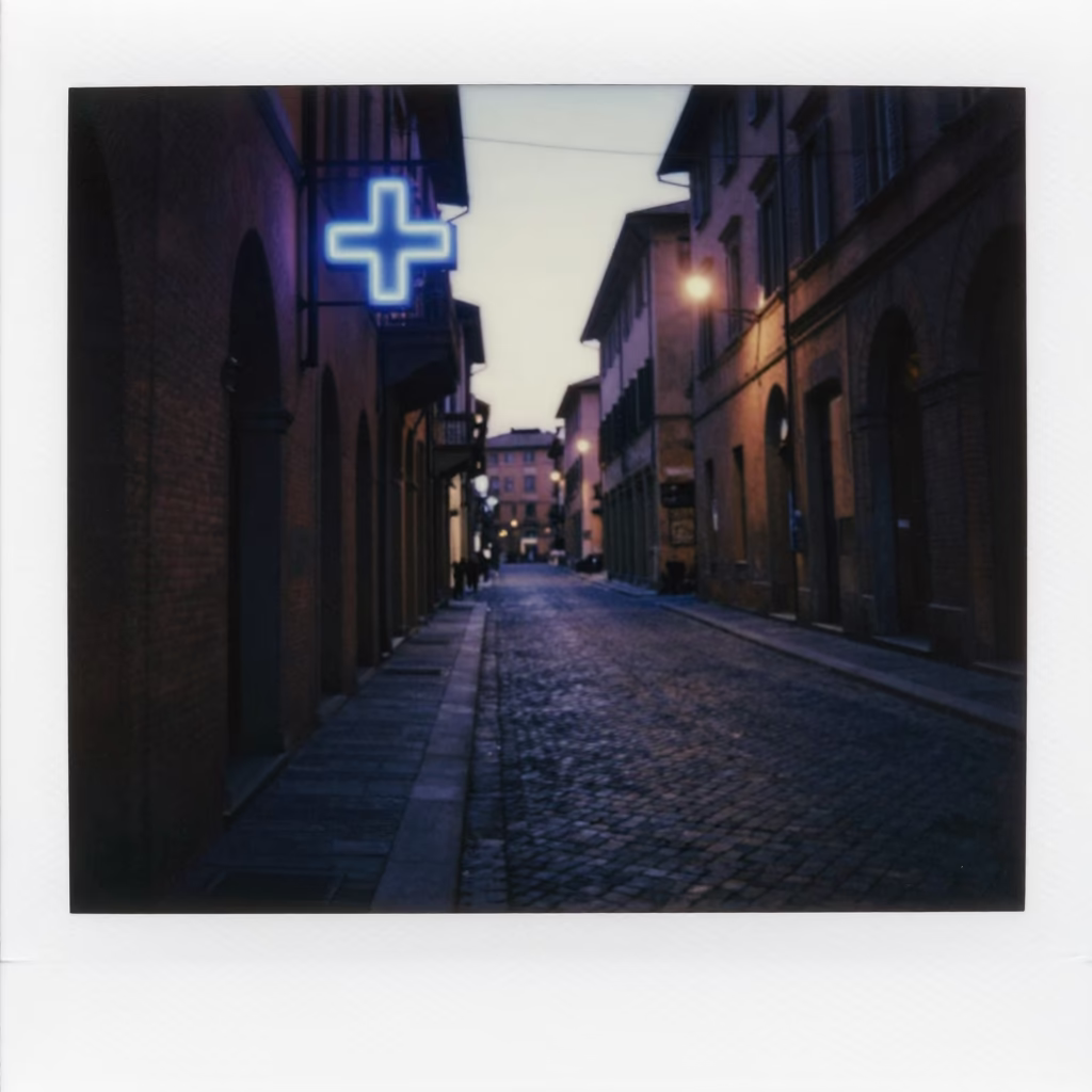 Predawn Bologna Italy street scene with neon sign and empty cobblestone alleyway in in Bologna, Italy
