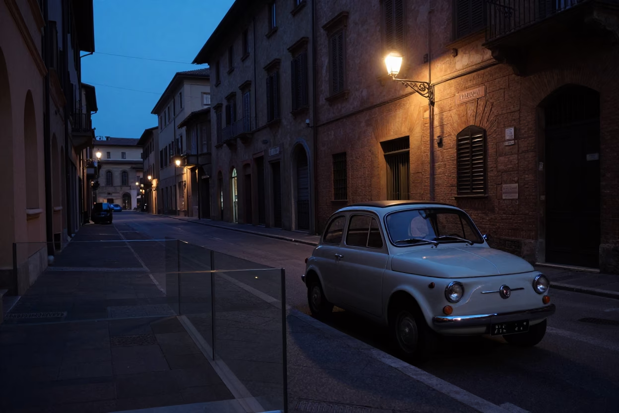 Predawn Bologna Italy Street Scene with Vintage Car and Clear Glass Rail in in Bologna, Italy