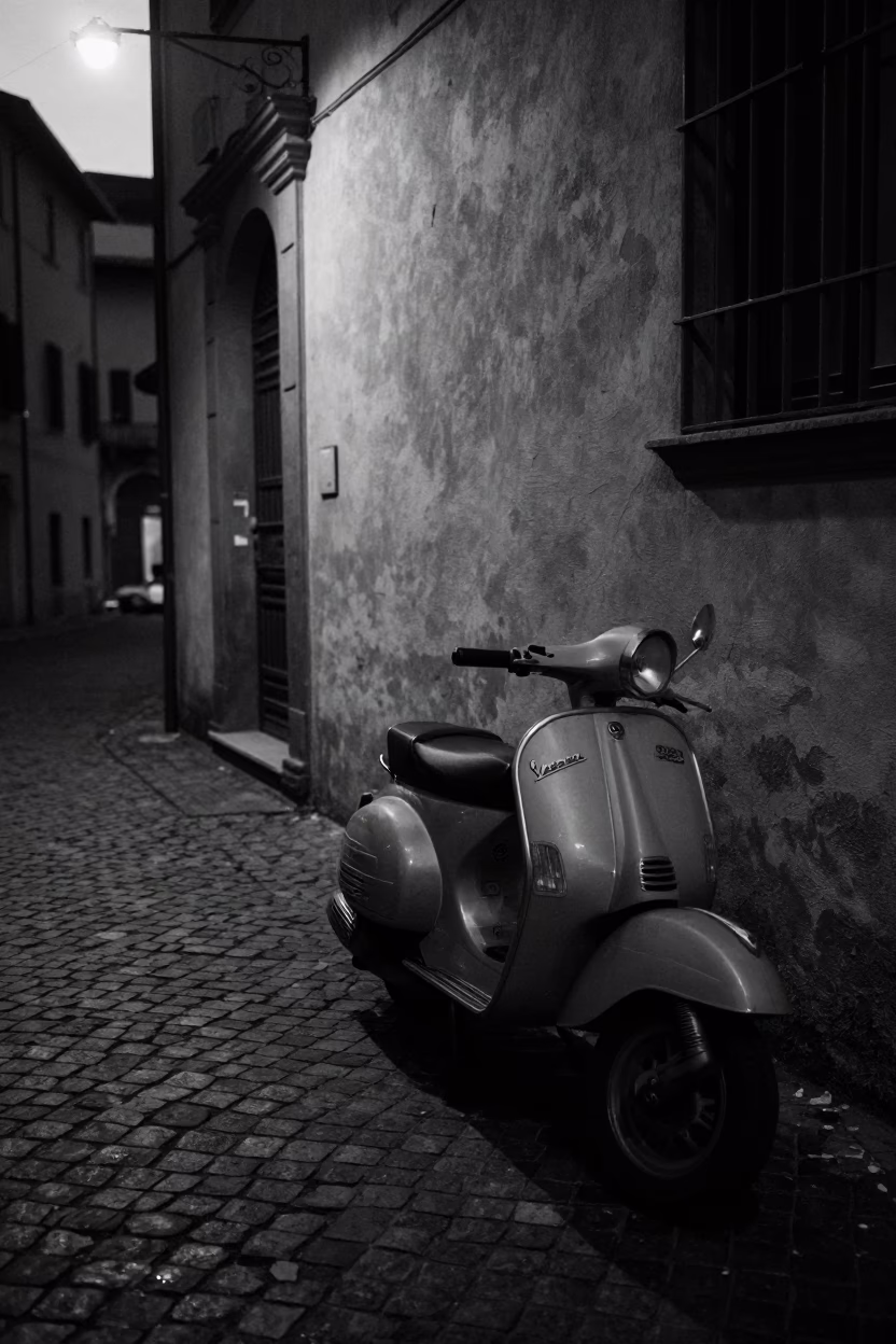Predawn Bologna Italy Street Scene with Vintage Scooter and Cobblestone Alley in in Bologna, Italy