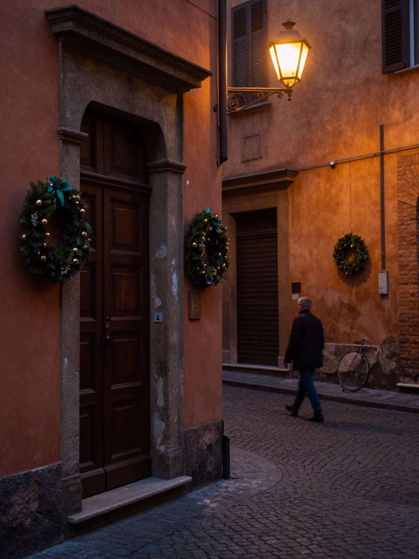 Predawn Bologna Street Scene with Historic Door Wreaths and Sodium Lamp Illumination in in Bologna, Italy