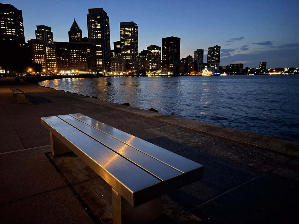 Predawn Boston Harbor Seawall with Brushed Steel Bench and Jar Amidst Early Morning Fog in in Boston, Massachusetts, United States