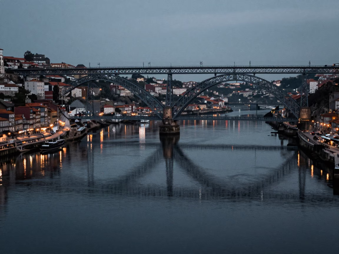 Predawn Bridge Pier Reflections and Aerial Tramway Gondola in Foggy Porto Portugal in in Porto, Portugal