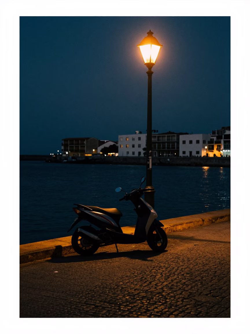 Predawn Cartagena Colombia Harbor Promenade with Parked Scooter and Streetlamp Glow in in Cartagena, Colombia