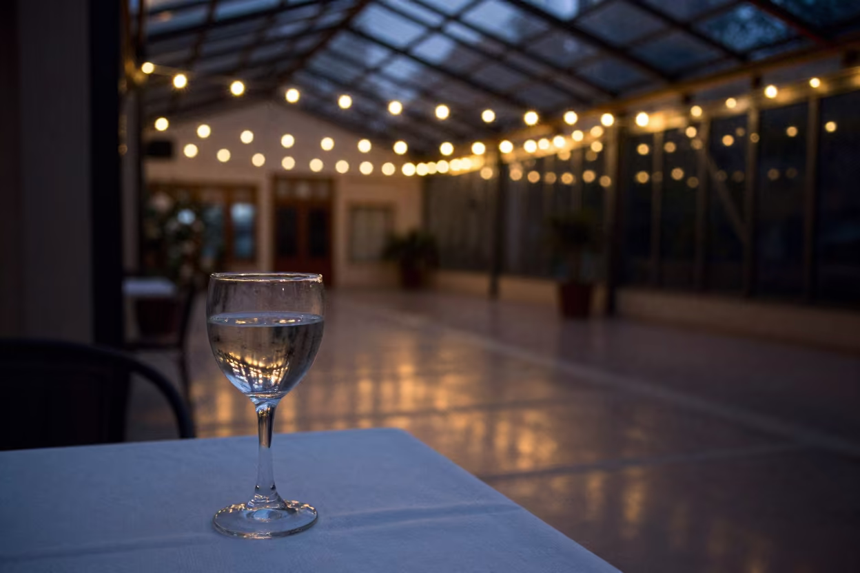 Predawn Caustics on White Tablecloth in inside a glass-roofed arcade near Damanhur