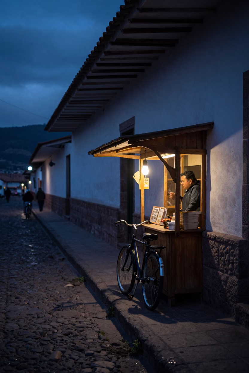 Predawn Cusco Street Scene with Bicycle and Bakery Stall in 1970s Peru in in Cusco, Peru