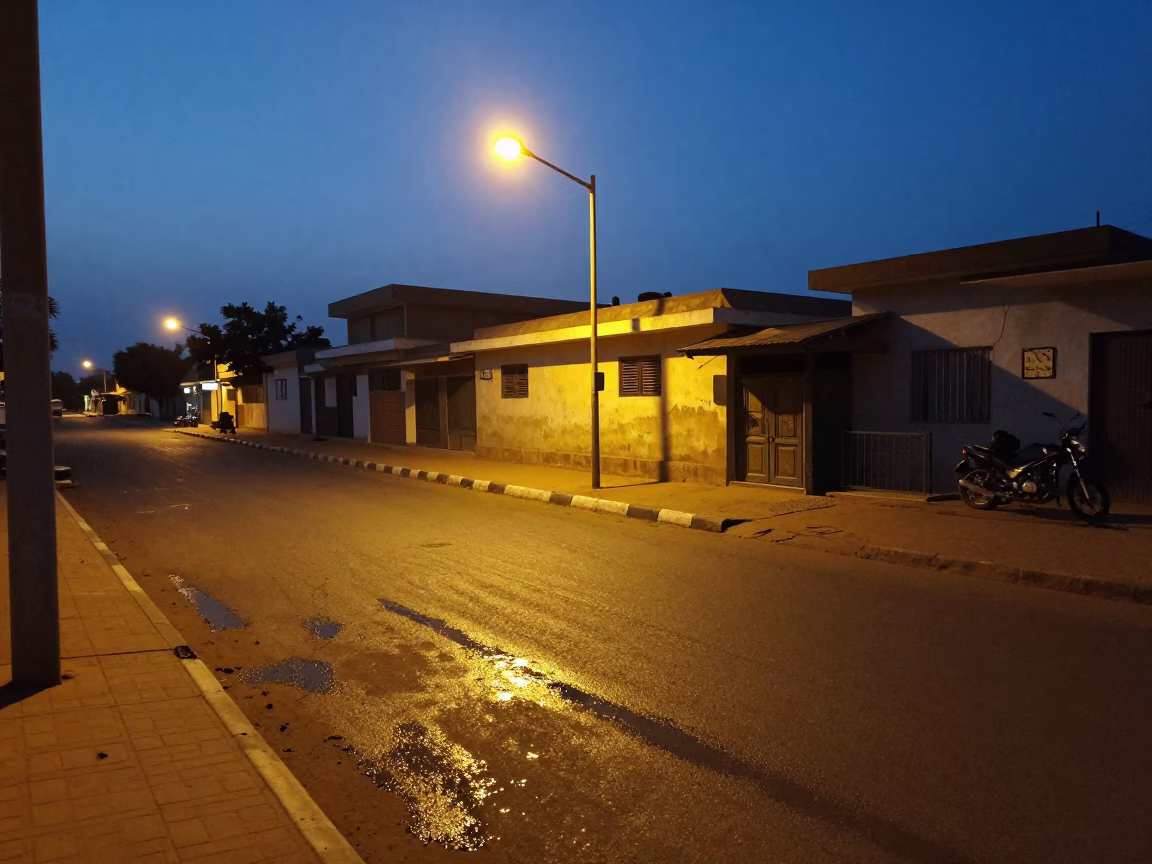 Predawn Dakar Senegal Street Scene with Grease Sheen and Early Morning Activity in in Dakar, Senegal