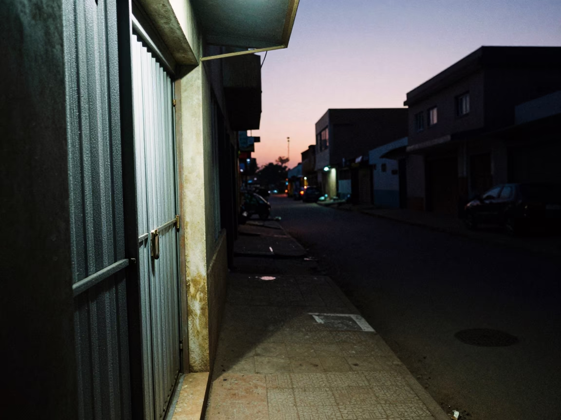 Predawn Dakar Street Scene with Condensation on Doorframe and Lockbox in in Dakar, Senegal