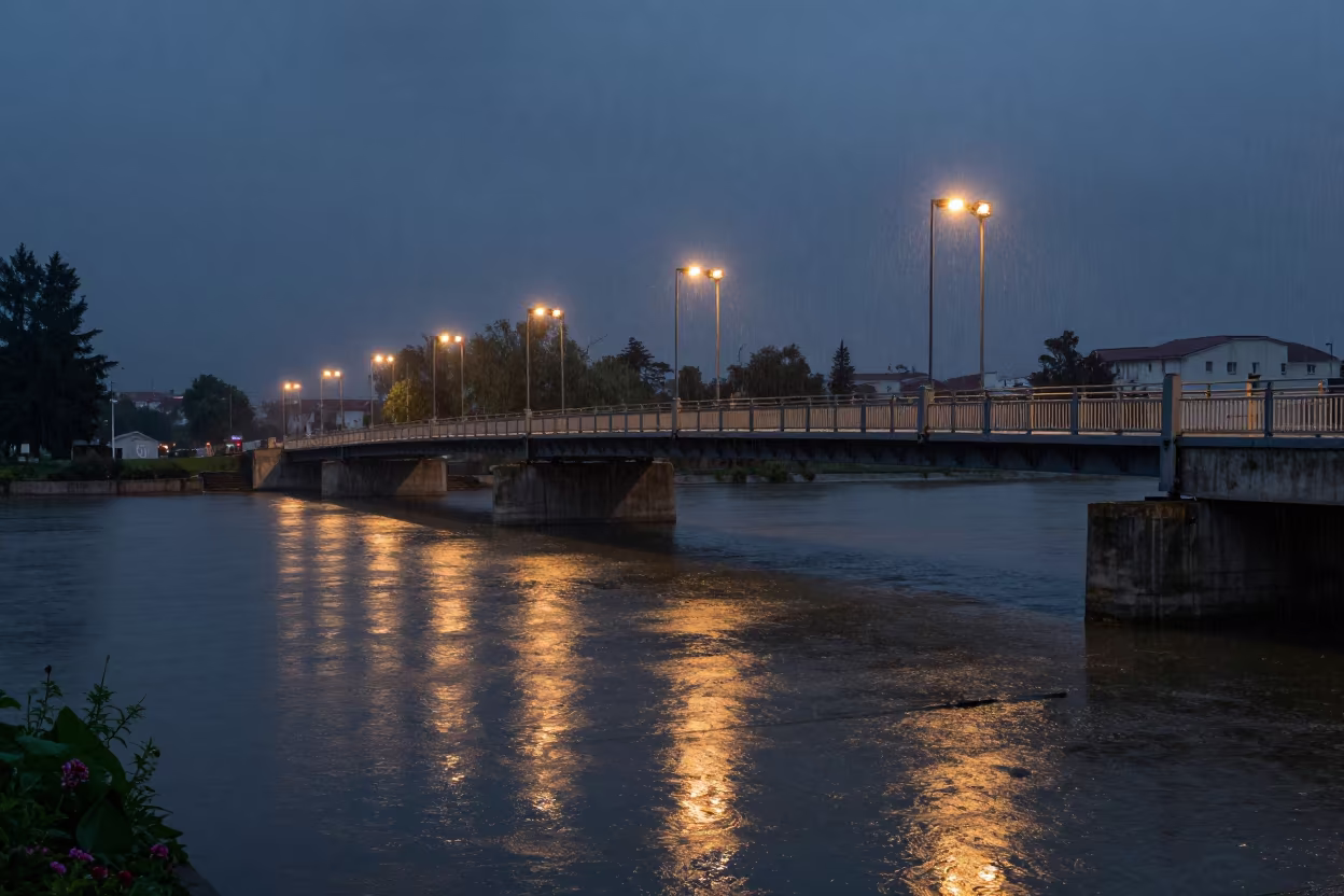 Predawn Drawbridge Over Moat in Çorum Monsoon in beside a bridge pier above moving water near Çorum