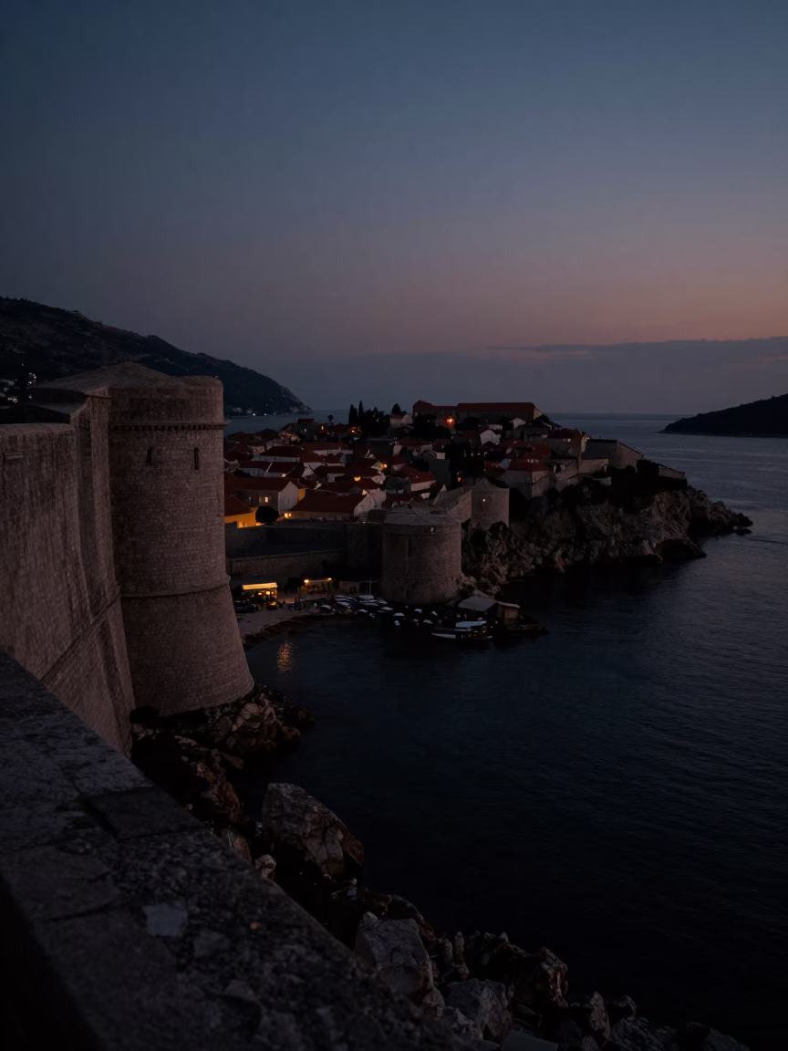 Predawn Dubrovnik Harbor View with Stone Walls and Dark Adriatic Sea in in Dubrovnik, Croatia