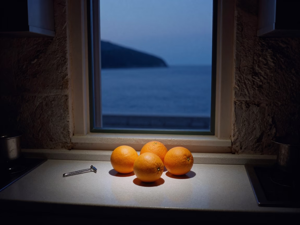 Predawn Dubrovnik Kitchen Counter with Oranges and Safety Razor in Dim Light in in Dubrovnik, Croatia