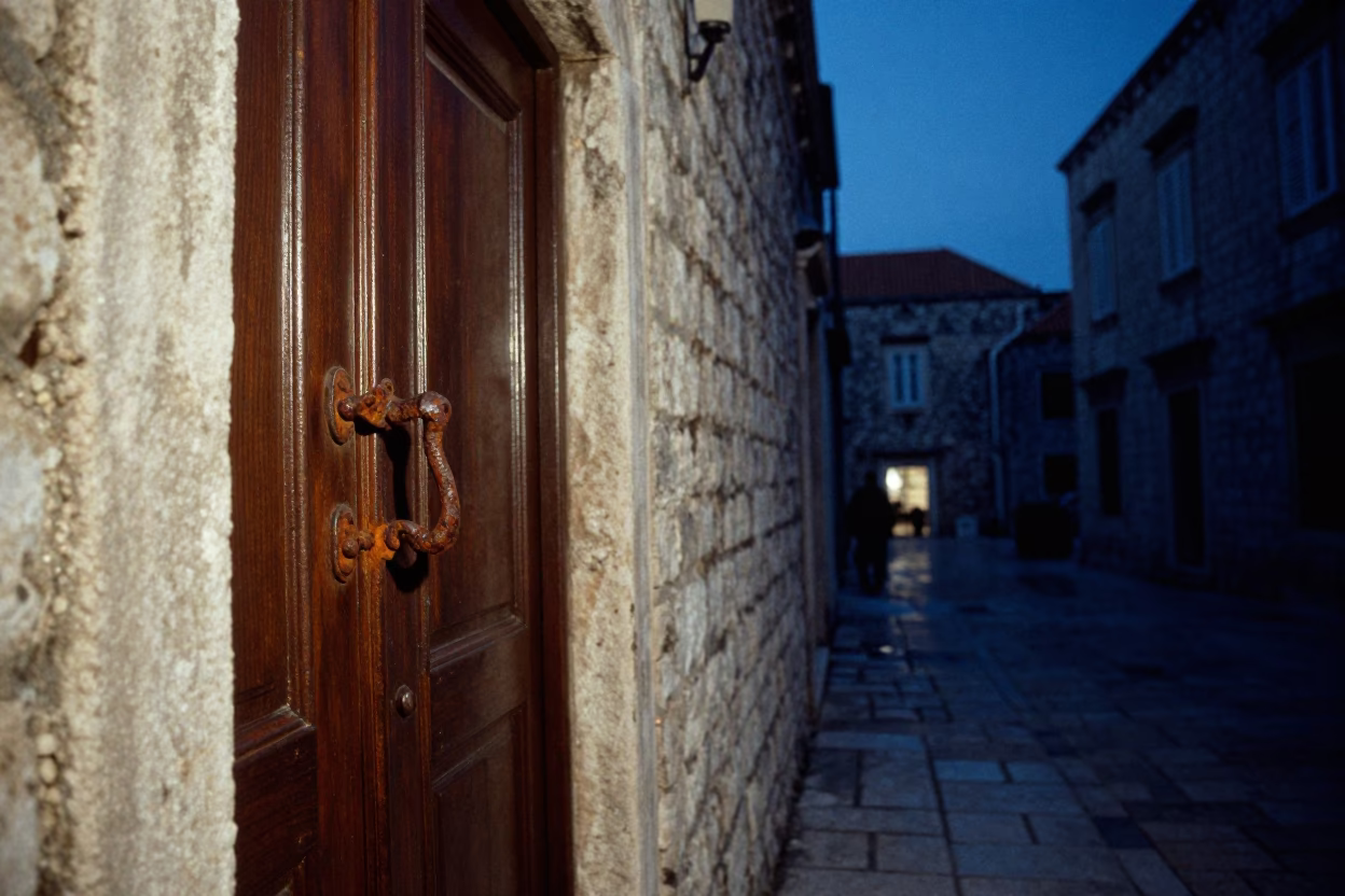 Predawn Dubrovnik Street Scene with Rusty Gate Handle and Woven Baskets in in Dubrovnik, Croatia